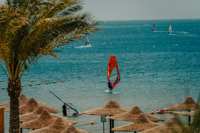 Windsurfer on a sandy beach beside the Red Sea